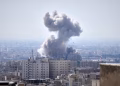 A plume of smoke rises after a strike in Tehran on Sunday. Photograph: Vahid Salemi/AP